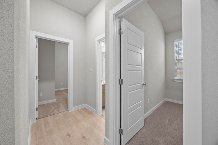 Hallway in the Cedar home plan by Trophy Signature Homes – REPRESENTATIVE PHOTO