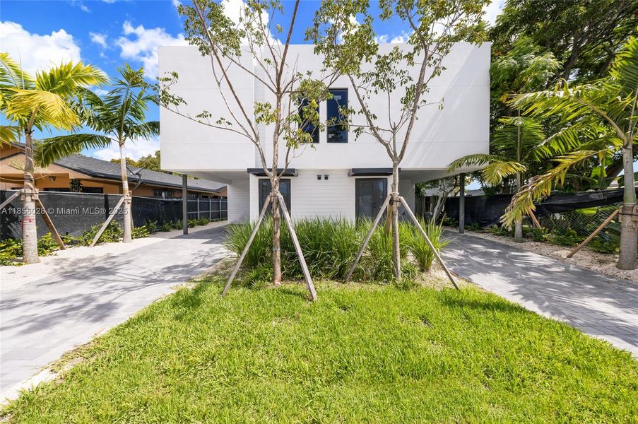 Front exterior of a new home in , Miami, FL, highlighting curb appeal (Image 11).