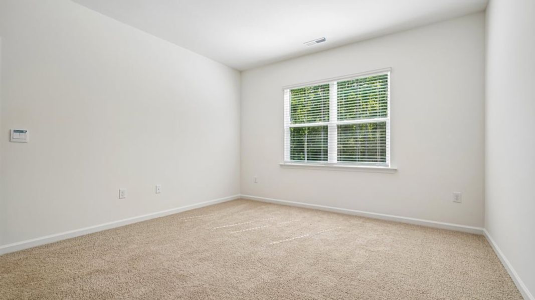 Spacious, unfurnished interior of a new home in The Villas at Laurel Oaks, Sanford (Image 26).