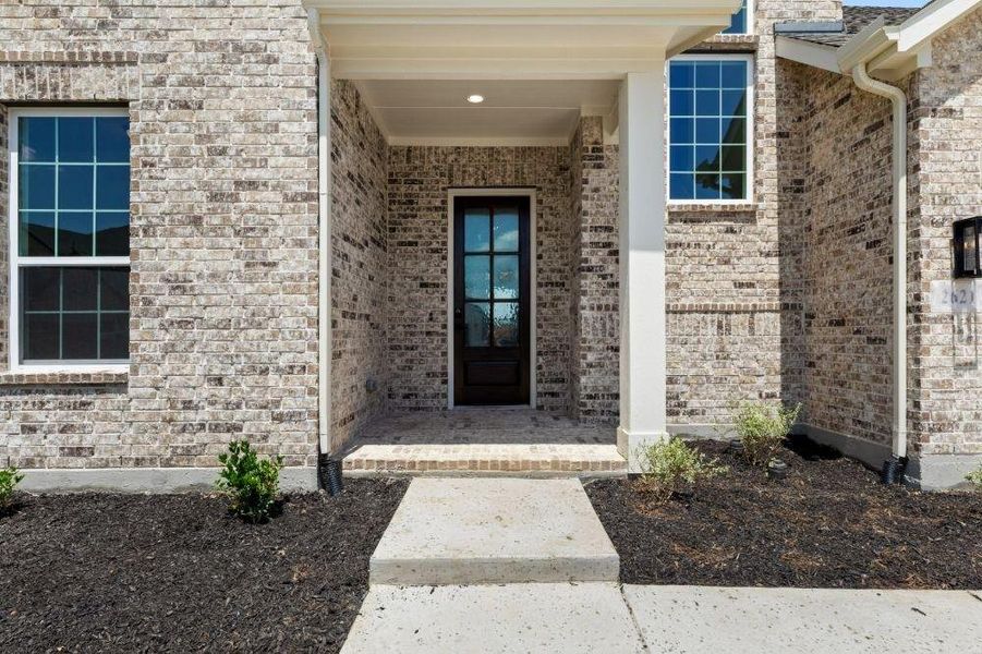 Front exterior of a new home in Cambridge Crossing, Celina, TX, highlighting curb appeal (Image 23). Front exterior of a new home in Cambridge Crossing, Celina, TX, highlighting curb appeal (Image 23).
