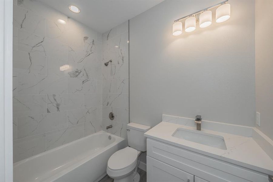 Full bathroom featuring vanity and shower / bath combination