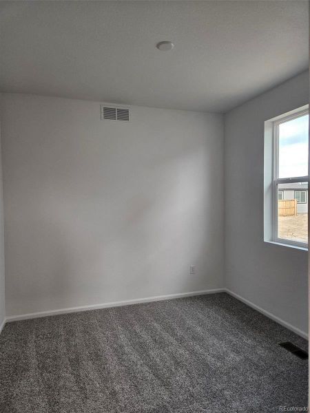 Spacious, unfurnished interior of a new home in The Cottages Collection at Ridgeline Vista, Brighton (Image 14).