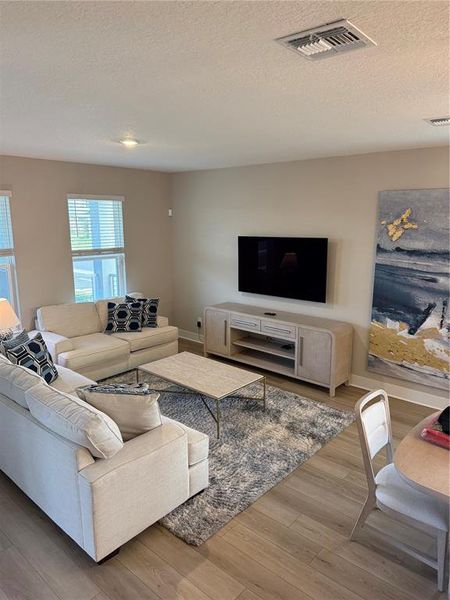 Furnished interior view inside a new home in Silverleaf Reserve Bungalows, Winter Garden (Image 7).