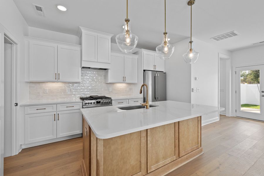 Representative furnished interior of a home built from the The Juniper by RobuckHomes in Kennebec Crossing, Angier (Image 9).