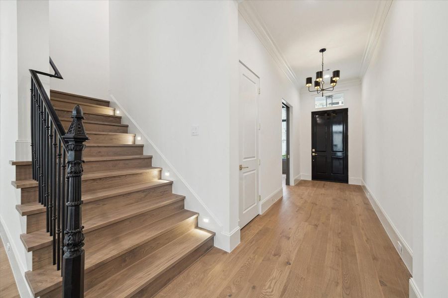 Thoughtful features, such as wrought iron stairway detail and LED integrated recessed lighting along the stairs can be found throughout the home and the community.