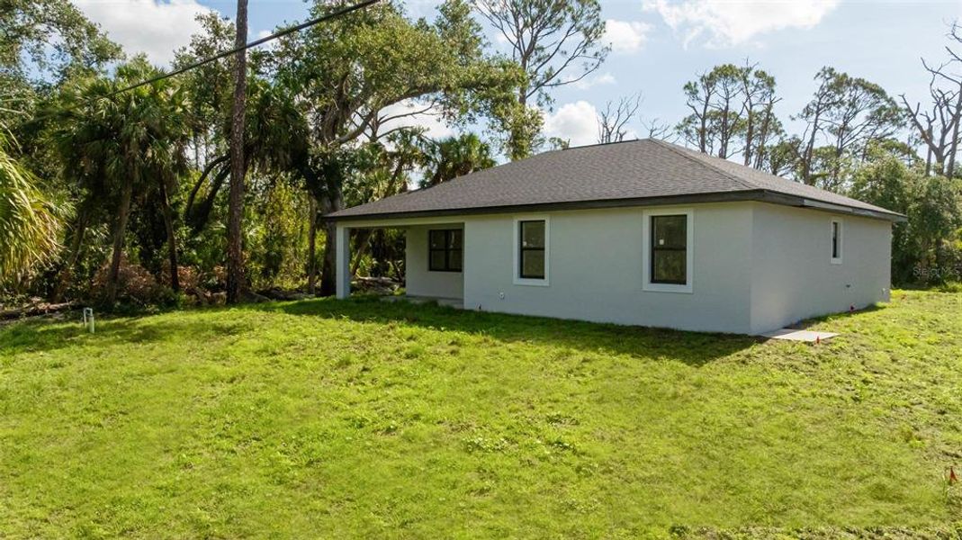 Exterior details and patio area of a home in , Port Charlotte (Image 24).