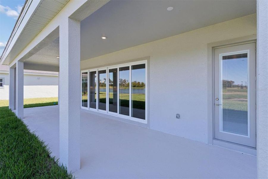 Exterior details and patio area of a home in North River Ranch, Parrish (Image 4).
