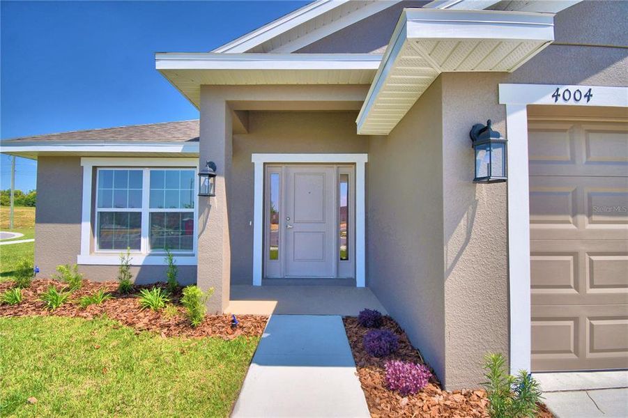 Exterior details and patio area of a home in Cadence Crossing, Auburndale (Image 21).