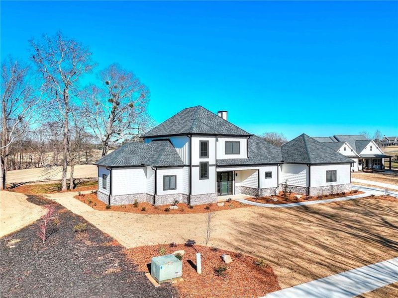 Front exterior of a new home in , Commerce, GA, highlighting curb appeal (Image 26).