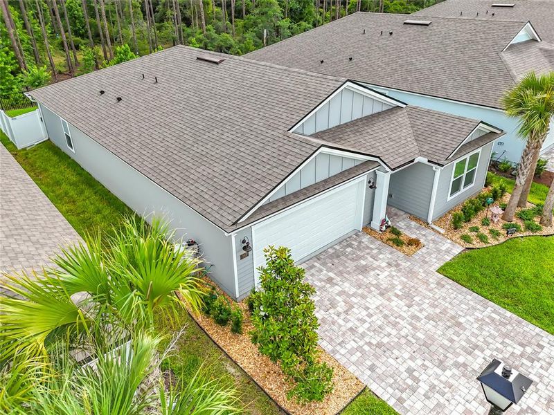 Exterior details and patio area of a home in Sawmill Branch Express, Palm Coast (Image 26).