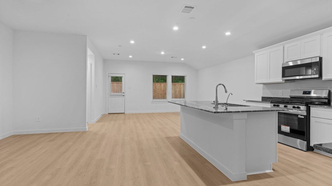 Furnished interior view inside a new home in Caldwell Crossing, Iowa Colony (Image 5).