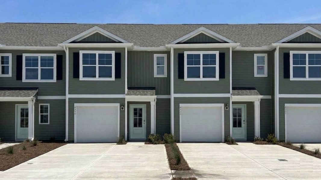Front exterior of a new home in The Willows at Blake Farm, Wilmington, NC, highlighting curb appeal (Image 1). Front exterior of a new home in The Willows at Blake Farm, Wilmington, NC, highlighting curb appeal (Image 1).