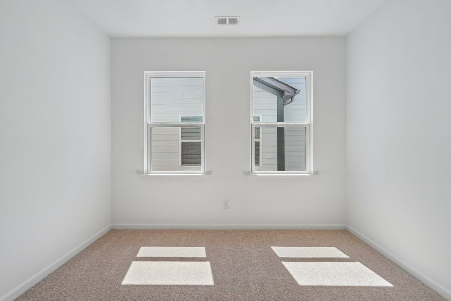 Spacious, unfurnished interior of a new home in Terraces at the Exchange, Indian Land (Image 17).