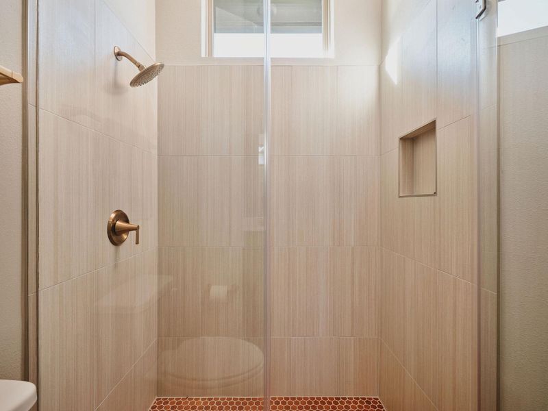 A beautiful walk-in shower completes the guest suite.