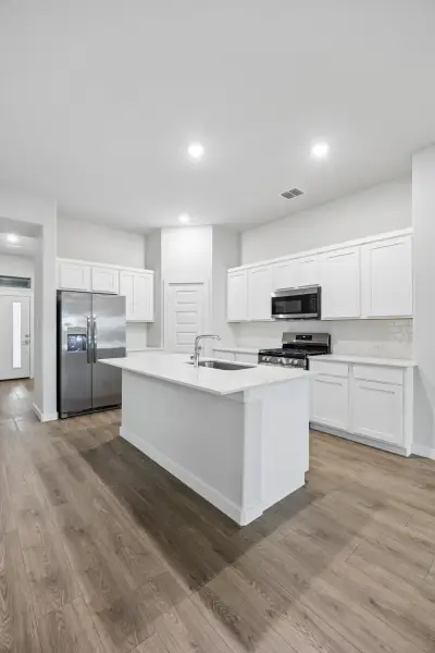 Kitchen in the Cedar home plan by Trophy Signature Homes – REPRESENTATIVE PHOTO Kitchen in the Cedar home plan by Trophy Signature Homes – REPRESENTATIVE PHOTO
