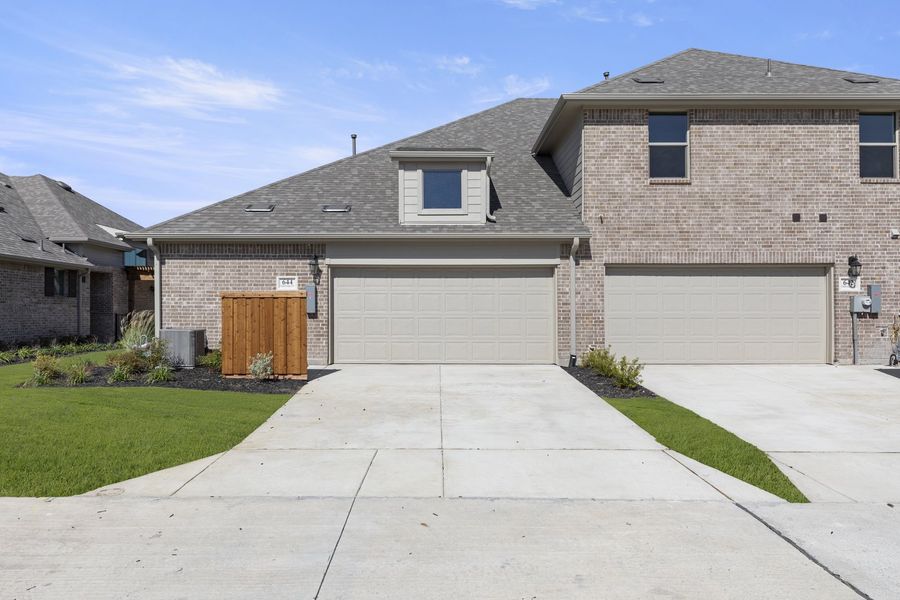 Front exterior of a new home in Woodbridge Villas, Wylie, TX, highlighting curb appeal (Image 20). Front exterior of a new home in Woodbridge Villas, Wylie, TX, highlighting curb appeal (Image 20).