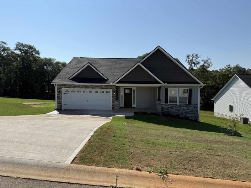 Front exterior of a new home in Fall Creek, Inman, SC, highlighting curb appeal (Image 1).