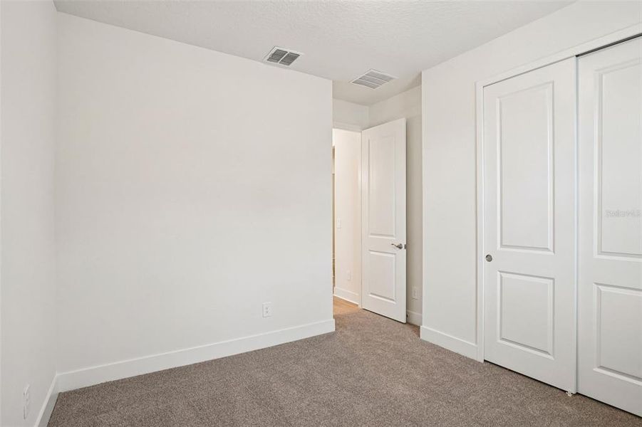 Spacious, unfurnished interior of a new home in Ridgehaven - Signature Series, Ormond Beach (Image 18).