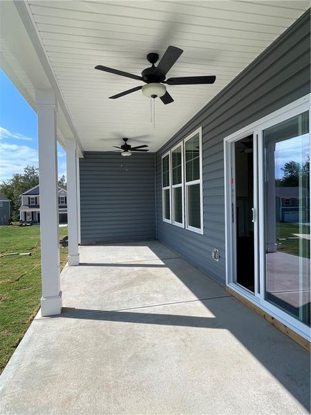 Exterior details and patio area of a home in Springwood Grove, Central (Image 3).