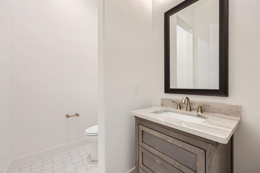 Bathroom with vanity and toilet