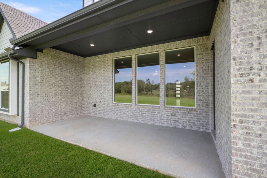 Exterior details and patio area of a home in Mockingbird Hills - Premiere Series, Joshua (Image 3).