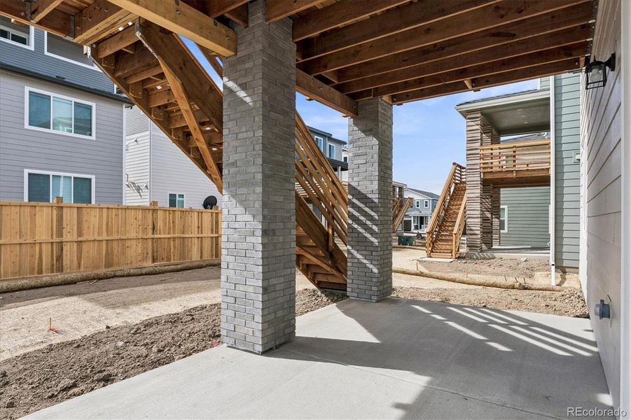 Exterior details and patio area of a home in The Summit at Meridian, Englewood (Image 19).