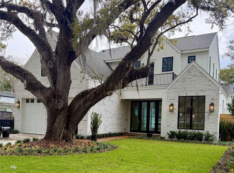 Front exterior of a new home in , Winter Park, FL, highlighting curb appeal (Image 1). Front exterior of a new home in , Winter Park, FL, highlighting curb appeal (Image 1).