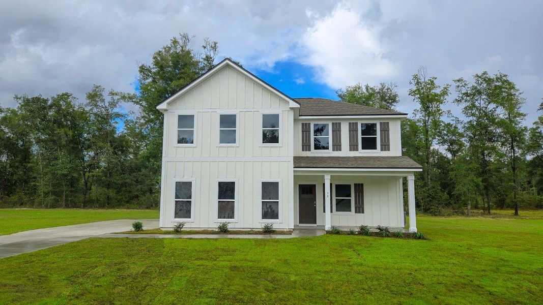 Front exterior of a new home in Greystone, Crawfordville, FL, highlighting curb appeal (Image 1). Front exterior of a new home in Greystone, Crawfordville, FL, highlighting curb appeal (Image 1).