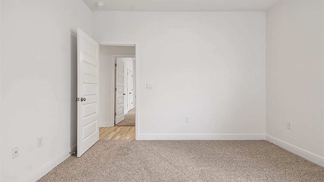 Representative unfurnished interior of a home built from the Kennedy by D.R. Horton in Bayside at Ward Creek, Panama City Beach (Image 32).