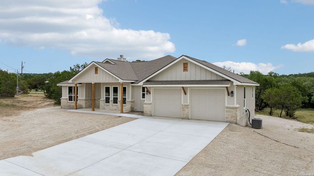Front exterior of a new home in , Canyon Lake, TX, highlighting curb appeal (Image 19).