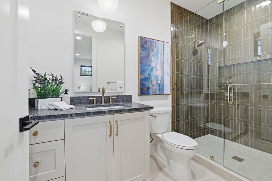 Full bathroom featuring vanity and a stall shower