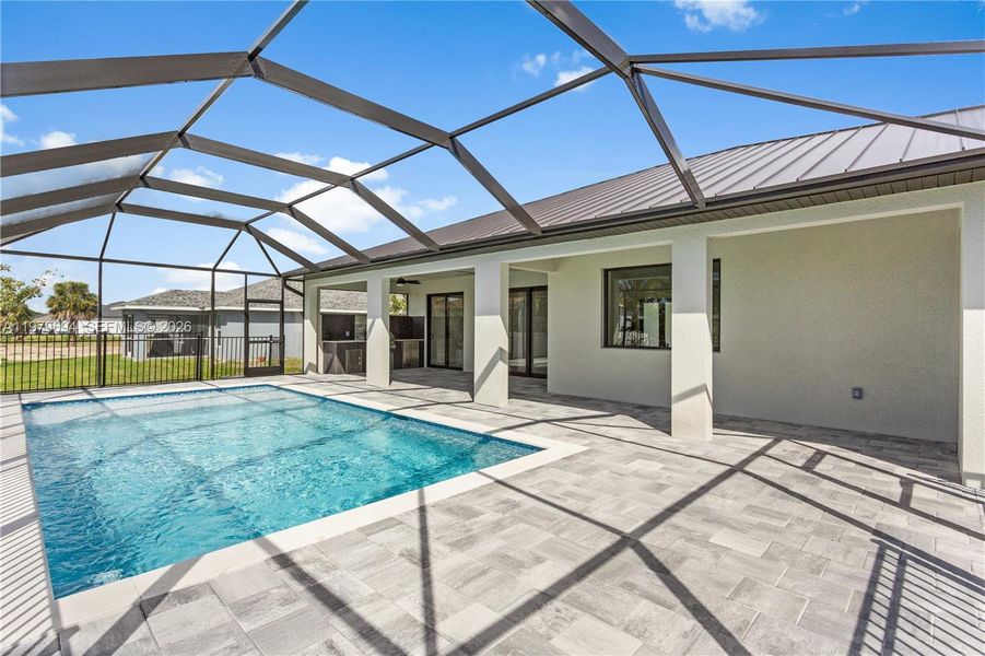 The screened pool area offers a refreshing retreat while keeping the outdoor space comfortable and protected. The screened pool area offers a refreshing retreat while keeping the outdoor space comfortable and protected.