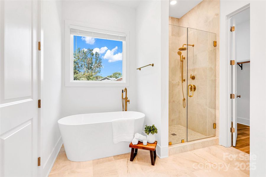 Large Primary Bathroom with soaking tub and walk in closet