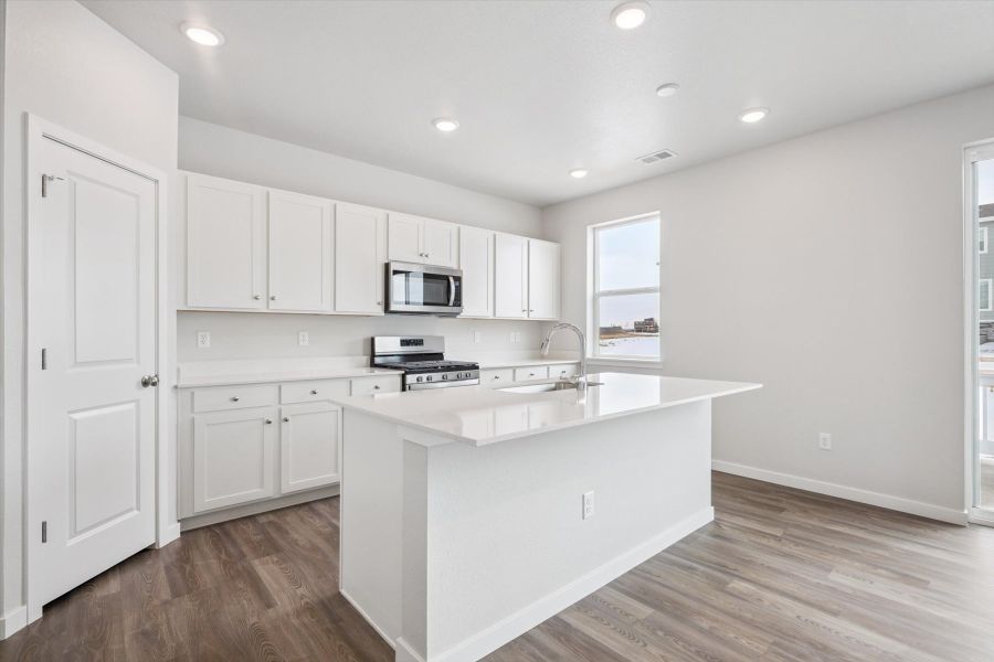 A kitchen with white cabinets. A kitchen with white cabinets.