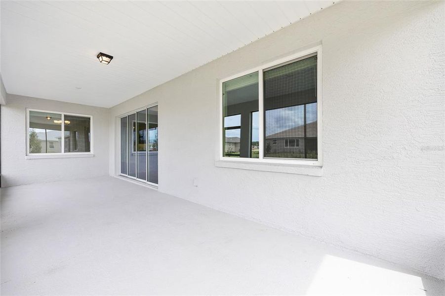 Exterior details and patio area of a home in On Top of the World Communities, Ocala (Image 3).