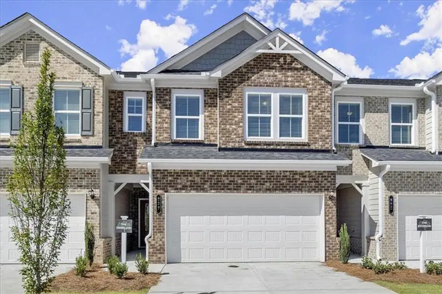 Front exterior of a new home in , Dacula, GA, highlighting curb appeal (Image 1). Front exterior of a new home in , Dacula, GA, highlighting curb appeal (Image 1).