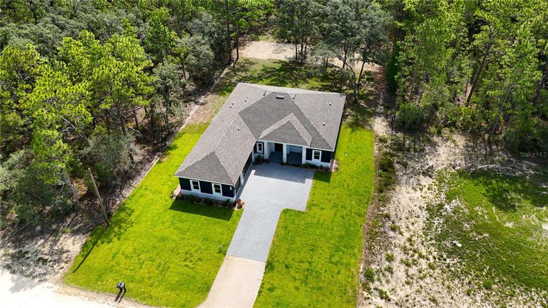 Front exterior of a new home in , Weeki Wachee, FL, highlighting curb appeal (Image 37).