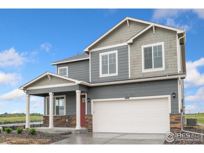 Front exterior of a new home in Silver Peaks, Lochbuie, CO, highlighting curb appeal (Image 1).