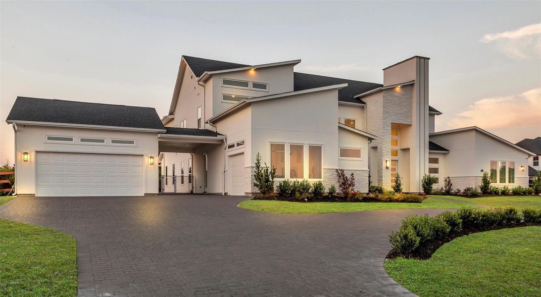 Motor Court:A grand motor court introduces the residence with elegance, where sleek pavers, ambient lighting, and a porte-cochère entry create a refined welcome for both everyday living and distinguished arrivals.