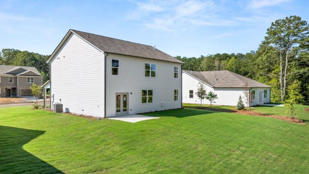 Front exterior of a new home in Fairhaven, Lithia Springs, GA, highlighting curb appeal (Image 23). Front exterior of a new home in Fairhaven, Lithia Springs, GA, highlighting curb appeal (Image 23).