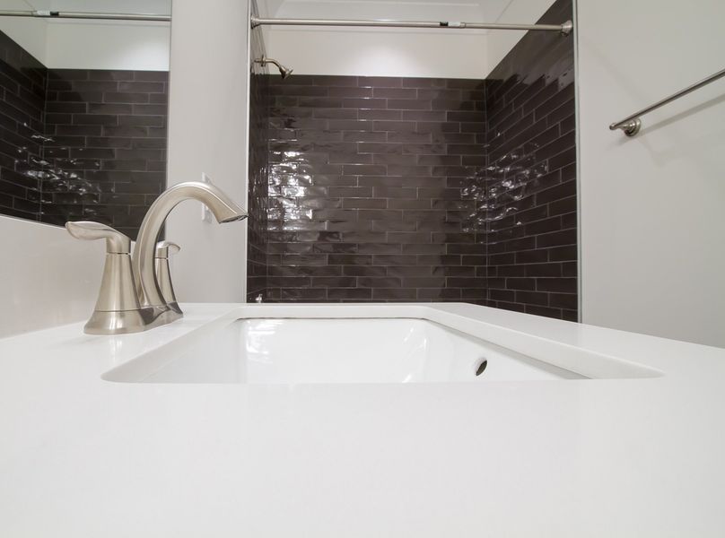 Representative furnished interior of a home built from the The Amherst by RobuckHomes in Windwater, Hampstead (Image 38).