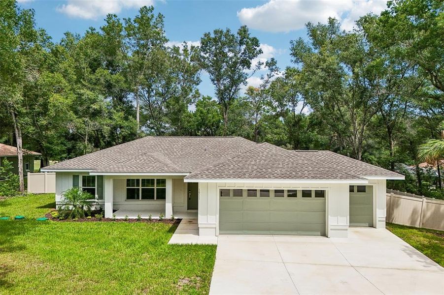 Front exterior of a new home in , Citrus Springs, FL, highlighting curb appeal (Image 23).