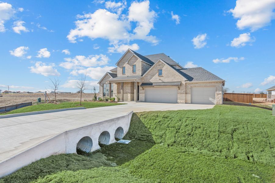 Front exterior of a new home in Settlers Glen, New Fairview, TX, highlighting curb appeal (Image 24). Front exterior of a new home in Settlers Glen, New Fairview, TX, highlighting curb appeal (Image 24).
