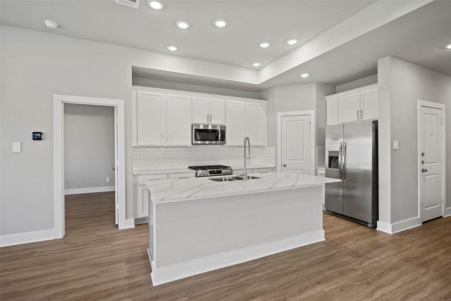 Generous storage and a walk-in pantry make organization a breeze.