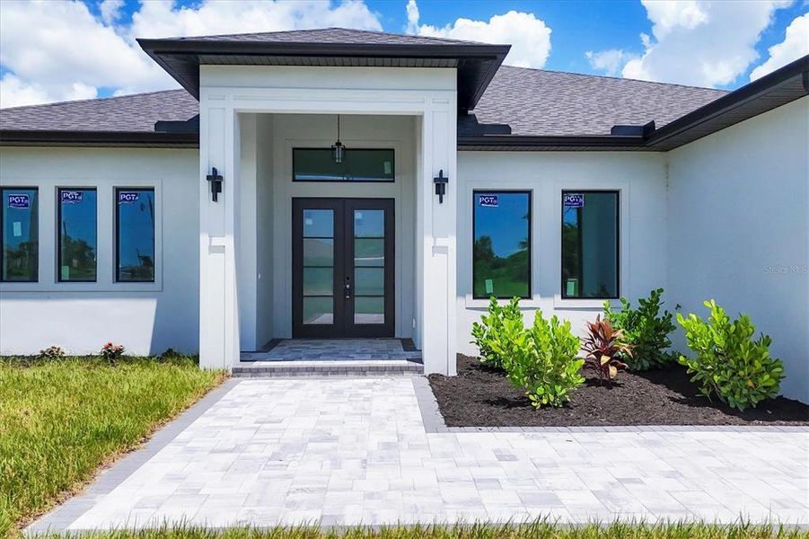 Front exterior of a new home in , Rotonda West, FL, highlighting curb appeal (Image 25).