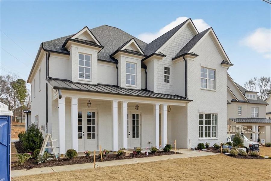 Front exterior of a new home in , Suwanee, GA, highlighting curb appeal (Image 27). Front exterior of a new home in , Suwanee, GA, highlighting curb appeal (Image 27).