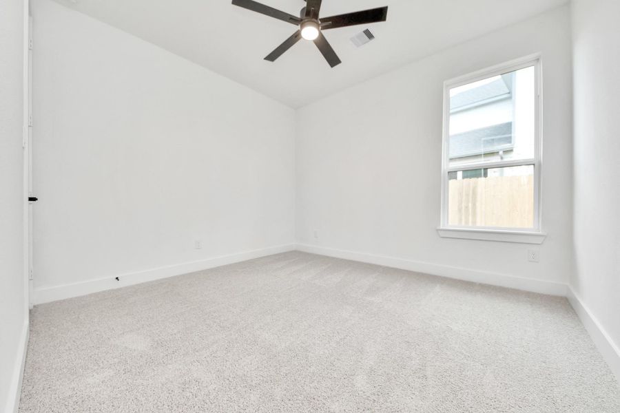 Generously sized secondary bedrooms featuring spacious closets, soft and inviting carpeting underfoot, large windows allowing plenty of natural light, and the added touch of privacy blinds for your personal retreat. Sample photo of completed home with similar floor plan. Actual colors and selections may vary. Generously sized secondary bedrooms featuring spacious closets, soft and inviting carpeting underfoot, large windows allowing plenty of natural light, and the added touch of privacy blinds for your personal retreat. Sample photo of completed home with similar floor plan. Actual colors and selections may vary.