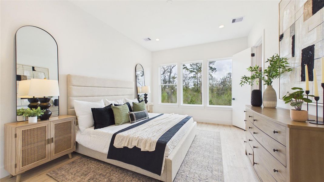 This oversized primary bedroom suite offers ample lighting, soaring ceilings, and recessed lighting throughout. A large closet is hidden away at the entrance for you to display your capsule wardrobe, or incredible maximalist finds!