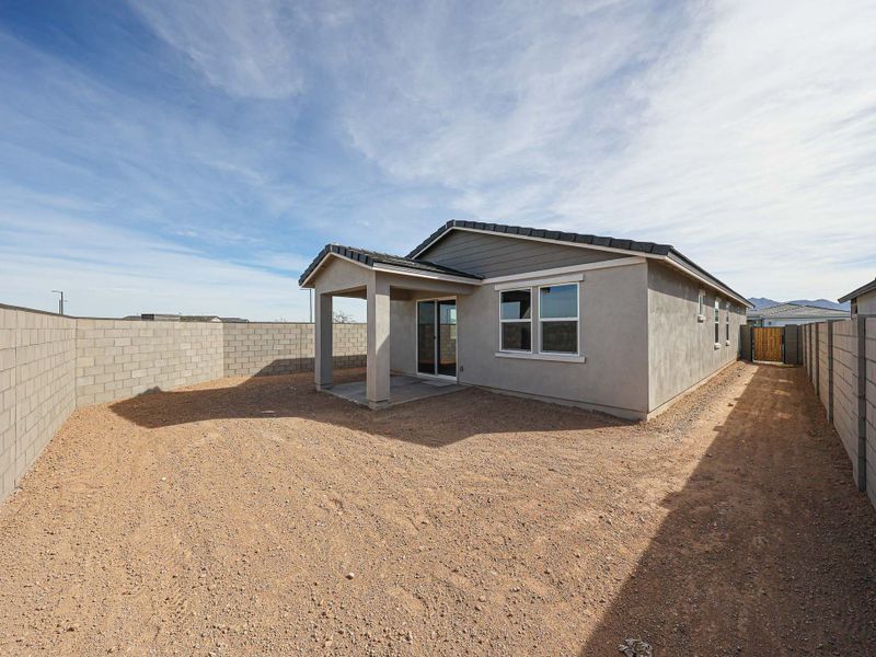 A building with a dirt road.