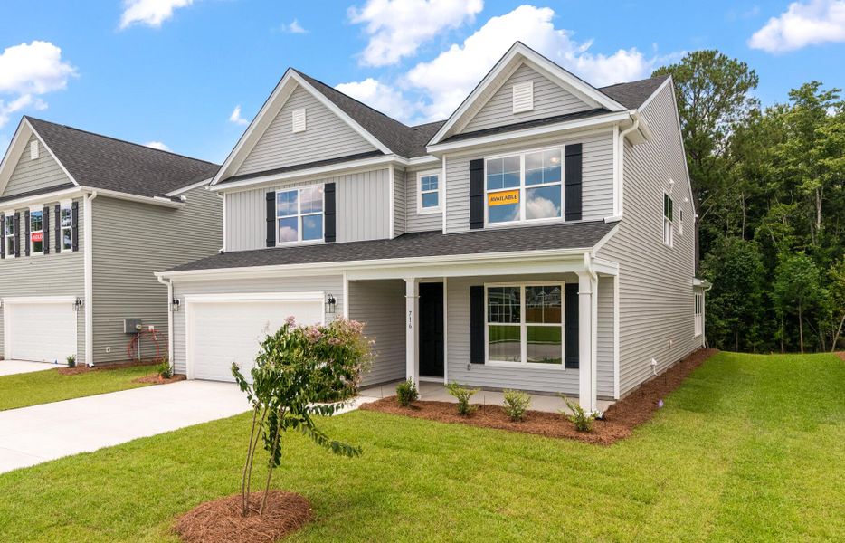 Front exterior of a new home in Oakley Pointe, Moncks Corner, SC, highlighting curb appeal (Image 2).